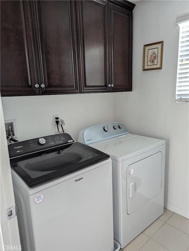 753 Huron Pl, Claremont, CA 91711 - washroom featuring washer and dryer, cabinet space, and light tile patterned floors