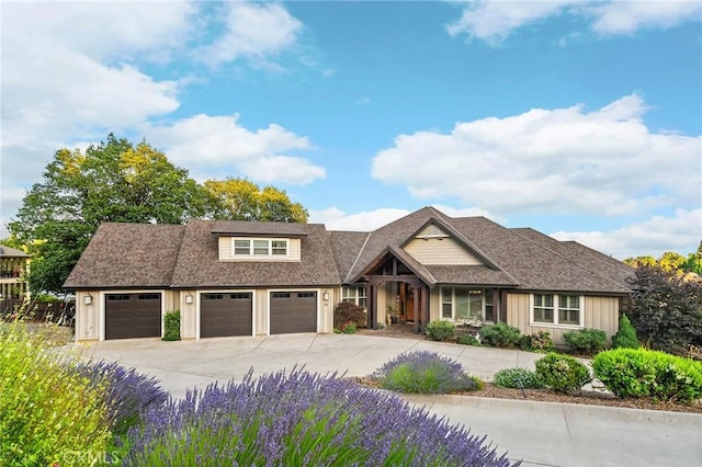 133 Valley Ridge Dr, Paradise, CA 95969 - view of front of property with board and batten siding, concrete driveway, a shingled roof, and a garage