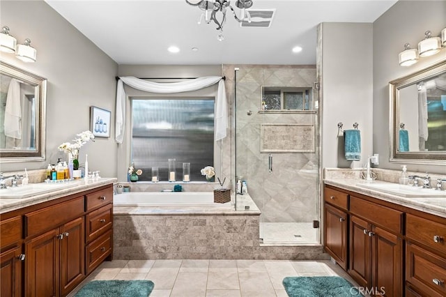 133 Valley Ridge Dr, Paradise, CA 95969 - bathroom with two vanities, a garden tub, a shower stall, tile patterned flooring, and recessed lighting