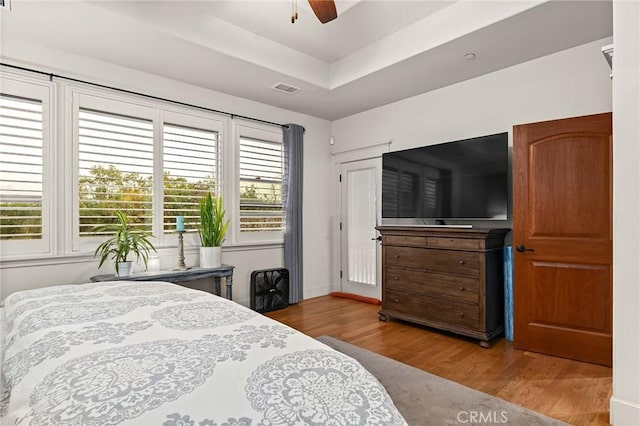 133 Valley Ridge Dr, Paradise, CA 95969 - bedroom featuring wood finished floors, a tray ceiling, and a ceiling fan