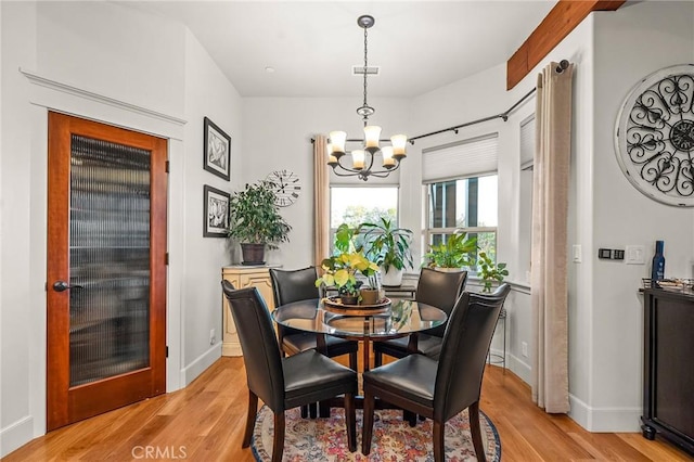 133 Valley Ridge Dr, Paradise, CA 95969 - dining area with a chandelier and light wood-style flooring