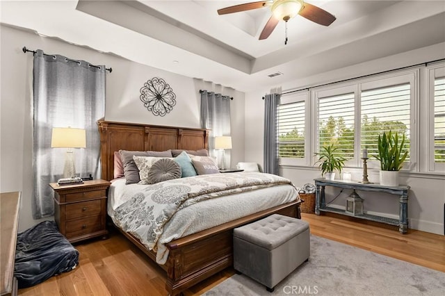 133 Valley Ridge Dr, Paradise, CA 95969 - bedroom featuring wood finished floors, a raised ceiling, and ceiling fan