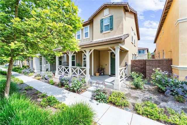 7469 Brahman Ln, Chino, CA 91708 - view of front of home with a porch, stucco siding, and a tiled roof