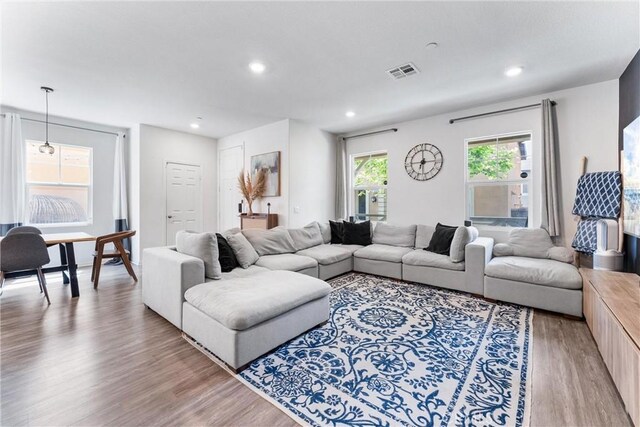 7469 Brahman Ln, Chino, CA 91708 - living room featuring light wood-type flooring and recessed lighting
