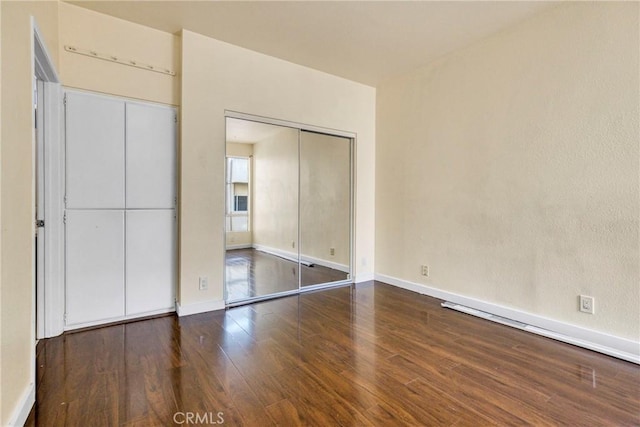 19350 Sherman Way Unit 223, Reseda, CA 91335 - unfurnished bedroom with wood finished floors and baseboards