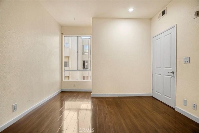 19350 Sherman Way Unit 223, Reseda, CA 91335 - spare room with wood finished floors, baseboards, and a textured wall
