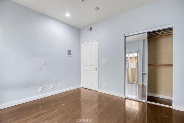 19350 Sherman Way Unit 223, Reseda, CA 91335 - unfurnished bedroom featuring wood finished floors, baseboards, and recessed lighting