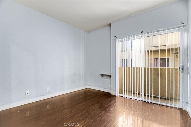 19350 Sherman Way Unit 223, Reseda, CA 91335 - spare room featuring wood finished floors and baseboards