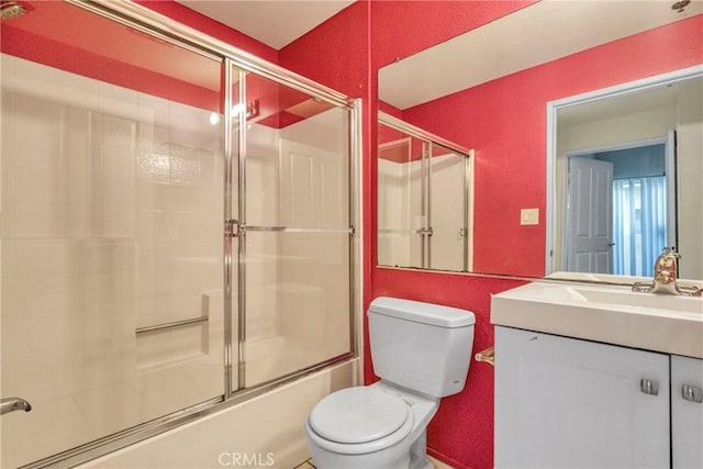 19350 Sherman Way Unit 223, Reseda, CA 91335 - bathroom featuring toilet, bath / shower combo with glass door, and vanity