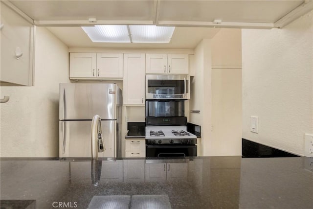 19350 Sherman Way Unit 223, Reseda, CA 91335 - kitchen featuring appliances with stainless steel finishes and white cabinetry