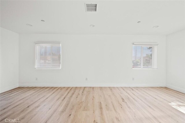 941 E 97th St, Los Angeles, CA 90002 - empty room featuring light wood finished floors and baseboards