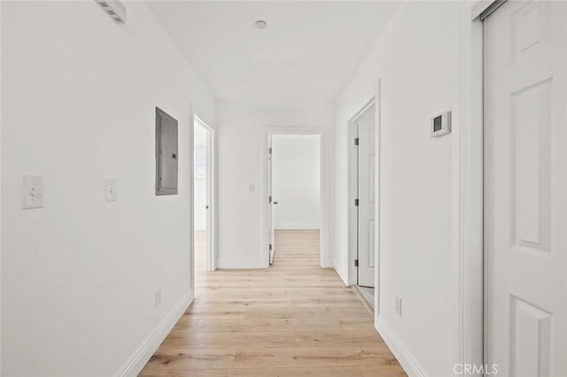 941 E 97th St, Los Angeles, CA 90002 - hall with electric panel, light wood finished floors, and baseboards