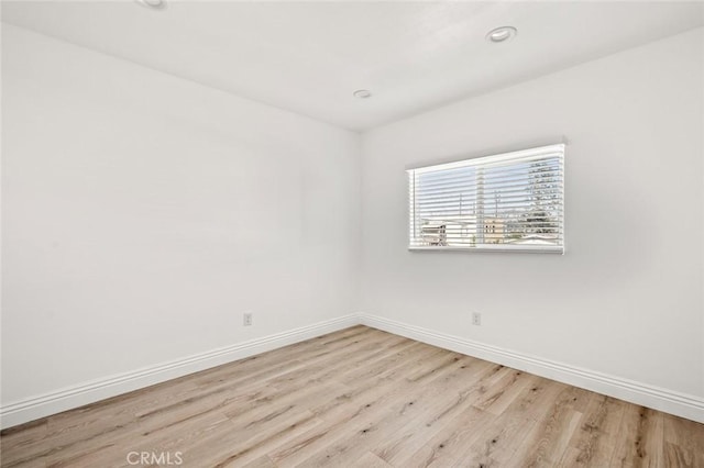 941 E 97th St, Los Angeles, CA 90002 - unfurnished room with wood finished floors, baseboards, and recessed lighting