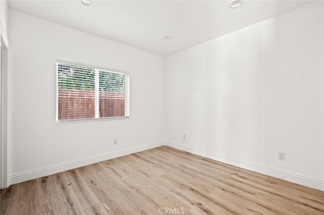 941 E 97th St, Los Angeles, CA 90002 - empty room with wood finished floors, baseboards, and recessed lighting