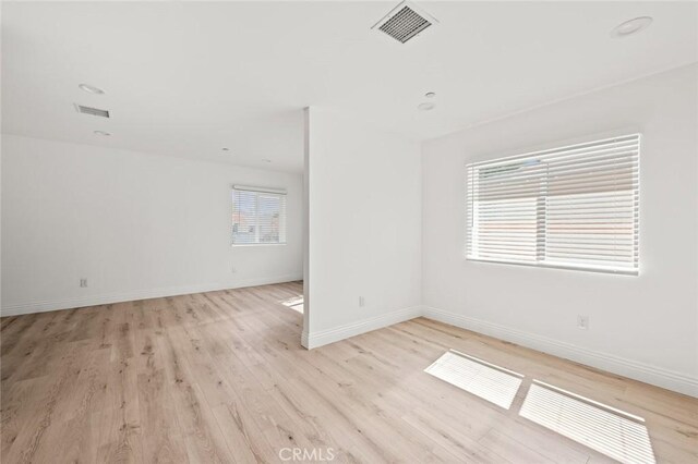 941 E 97th St, Los Angeles, CA 90002 - unfurnished room featuring light wood-style floors and baseboards