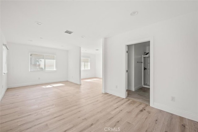941 E 97th St, Los Angeles, CA 90002 - unfurnished living room featuring light wood-style flooring, baseboards, and recessed lighting