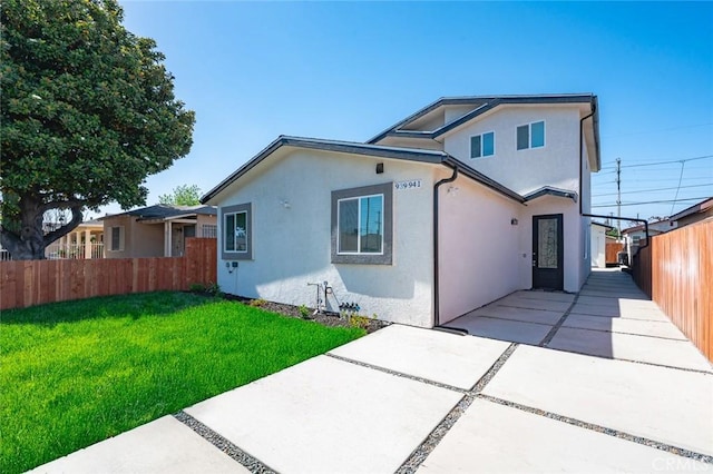 941 E 97th St, Los Angeles, CA 90002 - view of front of home featuring stucco siding and a patio area