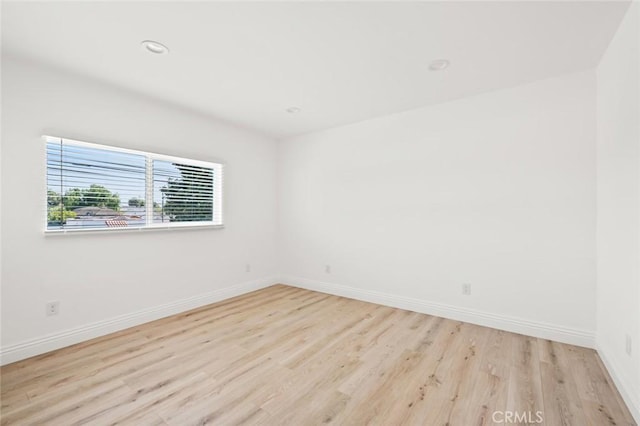 941 E 97th St, Los Angeles, CA 90002 - empty room featuring wood finished floors, baseboards, and recessed lighting