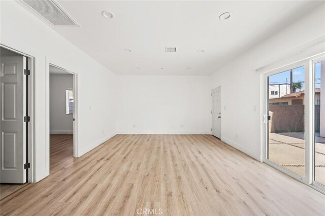 941 E 97th St, Los Angeles, CA 90002 - unfurnished room with light wood-type flooring, recessed lighting, and baseboards