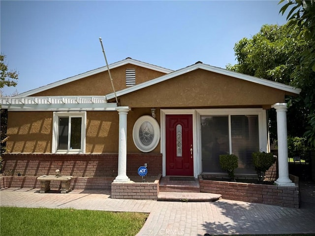 431 W M St, Colton, CA 92324 - view of front facade featuring stucco siding and a pergola