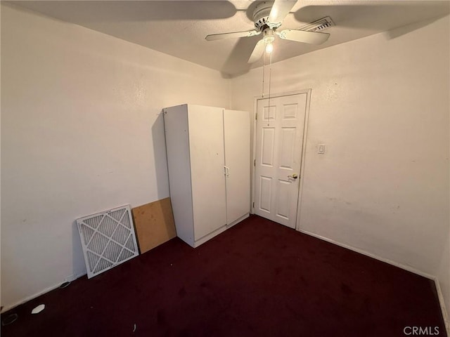 431 W M St, Colton, CA 92324 - unfurnished bedroom featuring dark carpet and ceiling fan