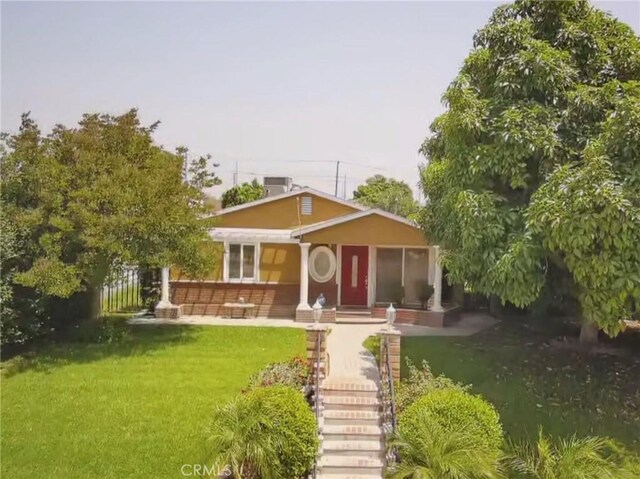 431 W M St, Colton, CA 92324 - view of front of house with a front lawn
