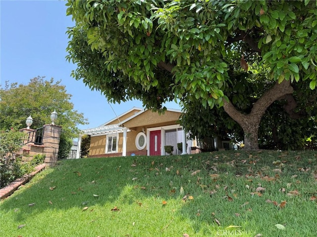 431 W M St, Colton, CA 92324 - view of front of house with a front lawn and stucco siding