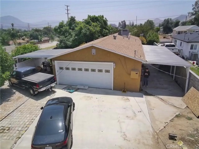 431 W M St, Colton, CA 92324 - view of front of house featuring concrete driveway, stucco siding, and a garage
