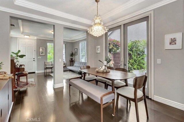 8 Marston Ln, Ladera Ranch, CA 92694 - dining room with baseboards, dark wood-style floors, a chandelier, and crown molding