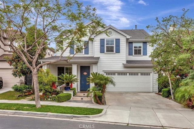 8 Marston Ln, Ladera Ranch, CA 92694 - traditional home with a garage, concrete driveway, and a shingled roof