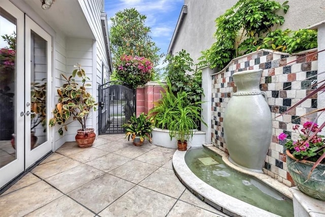 8 Marston Ln, Ladera Ranch, CA 92694 - view of patio / terrace with a gate and french doors