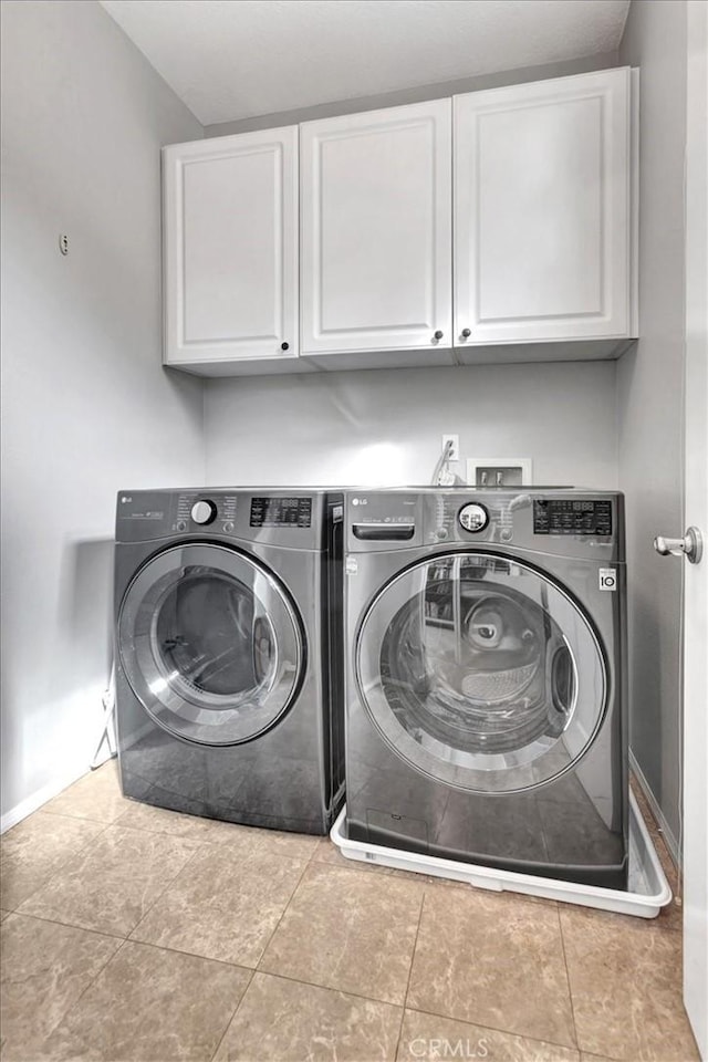 8 Marston Ln, Ladera Ranch, CA 92694 - washroom with cabinet space, separate washer and dryer, and baseboards
