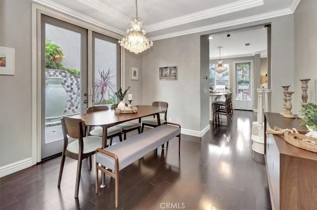 8 Marston Ln, Ladera Ranch, CA 92694 - dining room featuring baseboards, dark wood-style floors, crown molding, and a chandelier