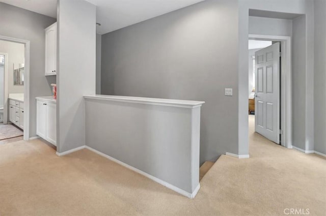 8 Marston Ln, Ladera Ranch, CA 92694 - hallway with light carpet, an upstairs landing, and baseboards