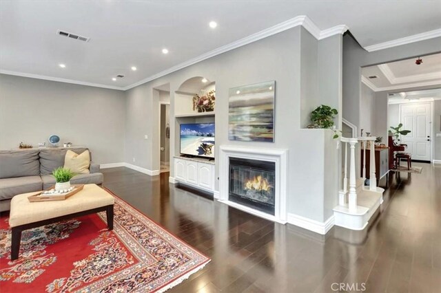 8 Marston Ln, Ladera Ranch, CA 92694 - living room featuring wood finished floors, baseboards, a glass covered fireplace, recessed lighting, and ornamental molding