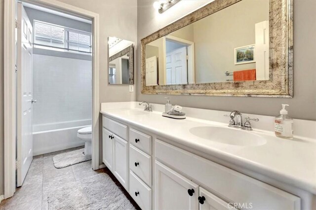 8 Marston Ln, Ladera Ranch, CA 92694 - full bath featuring toilet, double vanity, tile patterned flooring, and shower / bath combination