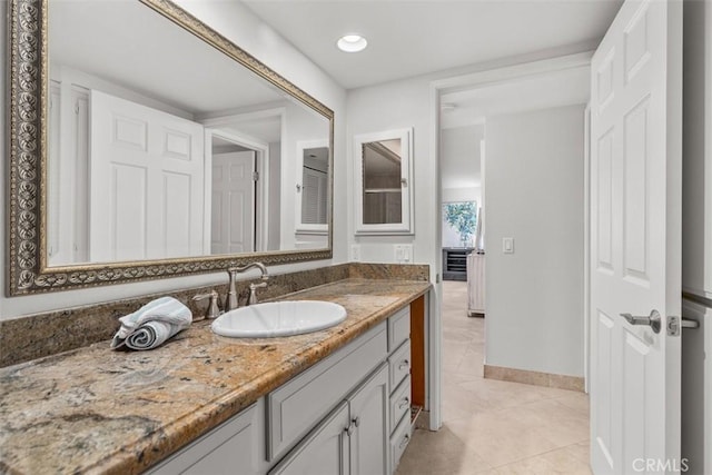 34132 Selva Rd Unit 252, Dana Point, CA 92629 - bathroom with vanity, tile patterned flooring, baseboards, and recessed lighting