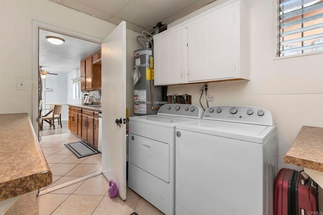 642 Carlsbad St, Spring Valley, CA 91977 - washroom with washing machine and clothes dryer, strapped water heater, healthy amount of natural light, and light tile patterned flooring