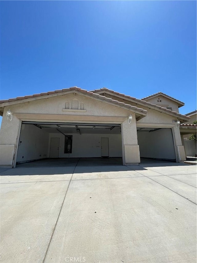 37000 Sabal Ave, Palmdale, CA 93552 - view of front of property featuring driveway, stucco siding, and a garage