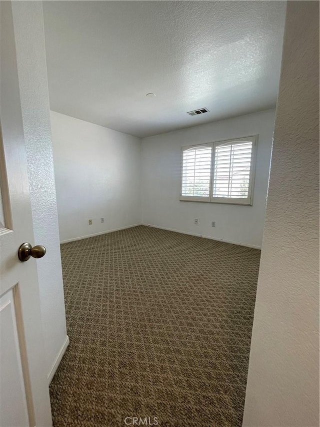 37000 Sabal Ave, Palmdale, CA 93552 - unfurnished room with carpet floors and a textured ceiling