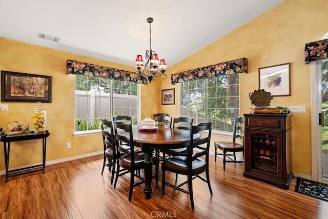 2860 Cathedral Ln, Arroyo Grande, CA 93420 - dining area featuring a chandelier, baseboards, wood finished floors, and vaulted ceiling