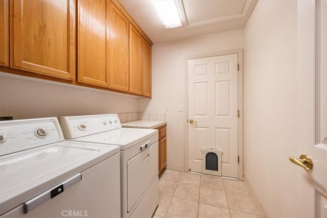 2860 Cathedral Ln, Arroyo Grande, CA 93420 - laundry room featuring washer and dryer, cabinet space, baseboards, and light tile patterned flooring