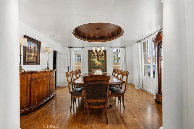 401 Piazza Lido, Newport Beach, CA 92663 - dining area with wood finished floors, a raised ceiling, a chandelier, and baseboards