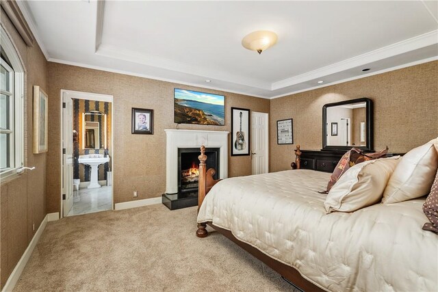 401 Piazza Lido, Newport Beach, CA 92663 - bedroom with crown molding, a tray ceiling, a lit fireplace, and carpet flooring