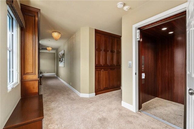 401 Piazza Lido, Newport Beach, CA 92663 - corridor featuring carpet, elevator, and baseboards