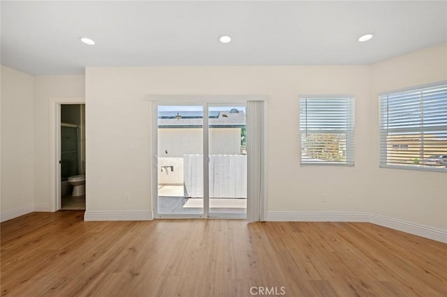 7513 S Cimarron St, Los Angeles, CA 90047 - empty room with light wood-style floors and recessed lighting