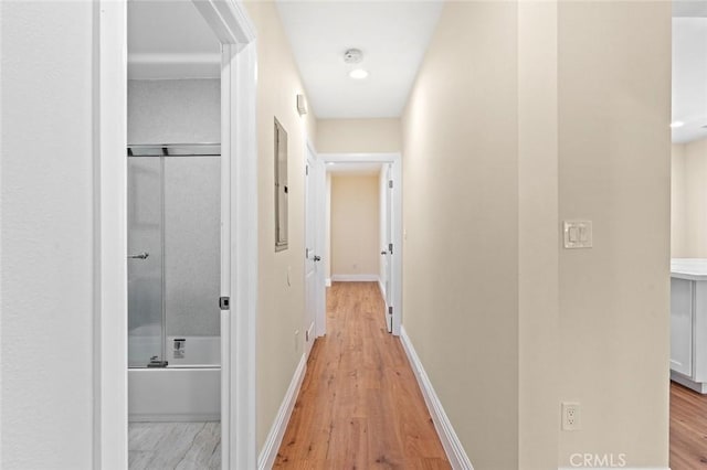 7513 S Cimarron St, Los Angeles, CA 90047 - hallway with light wood-style floors