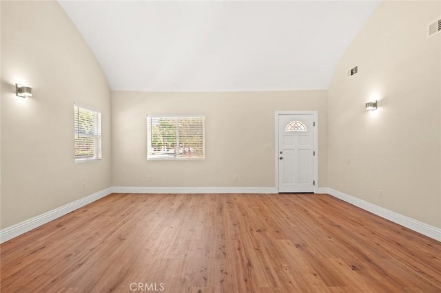 7513 S Cimarron St, Los Angeles, CA 90047 - unfurnished room featuring light wood-type flooring and high vaulted ceiling
