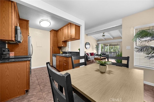 1345 Cabrillo Park Dr Unit S16, Santa Ana, CA 92701 - dining space with ceiling fan, baseboards, and dark tile patterned flooring