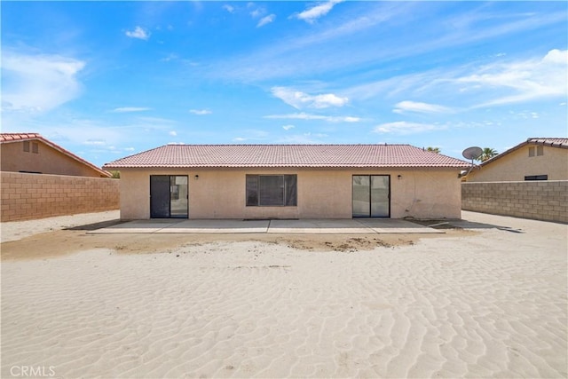 27505 Ventura Dr, Cathedral City, CA 92234 - rear view of house with stucco siding, a fenced backyard, and a patio area